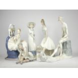 A collection of six Nao/Lladro porcelain figurines, to include harlequin and ballerina groups,