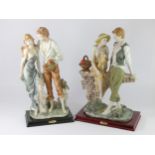 Two La Anina Collection cold cast figures, one depicting lovers on a stone bridge, 28cm x 45cm,