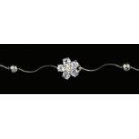 A 14K white gold, tanzanite and diamond cluster bracelet, 18cm, 4.7gm