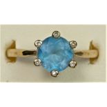 A 9ct gold blue topaz single stone ring, diamond set claws, N 1/2, 3.1gm