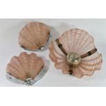 An Art Deco period clam ceiling light, together with a pair of matching wall lights, chrome with