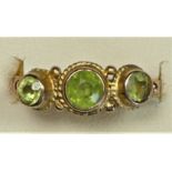 A 9ct gold peridot three stone ring, L, 1.5gm