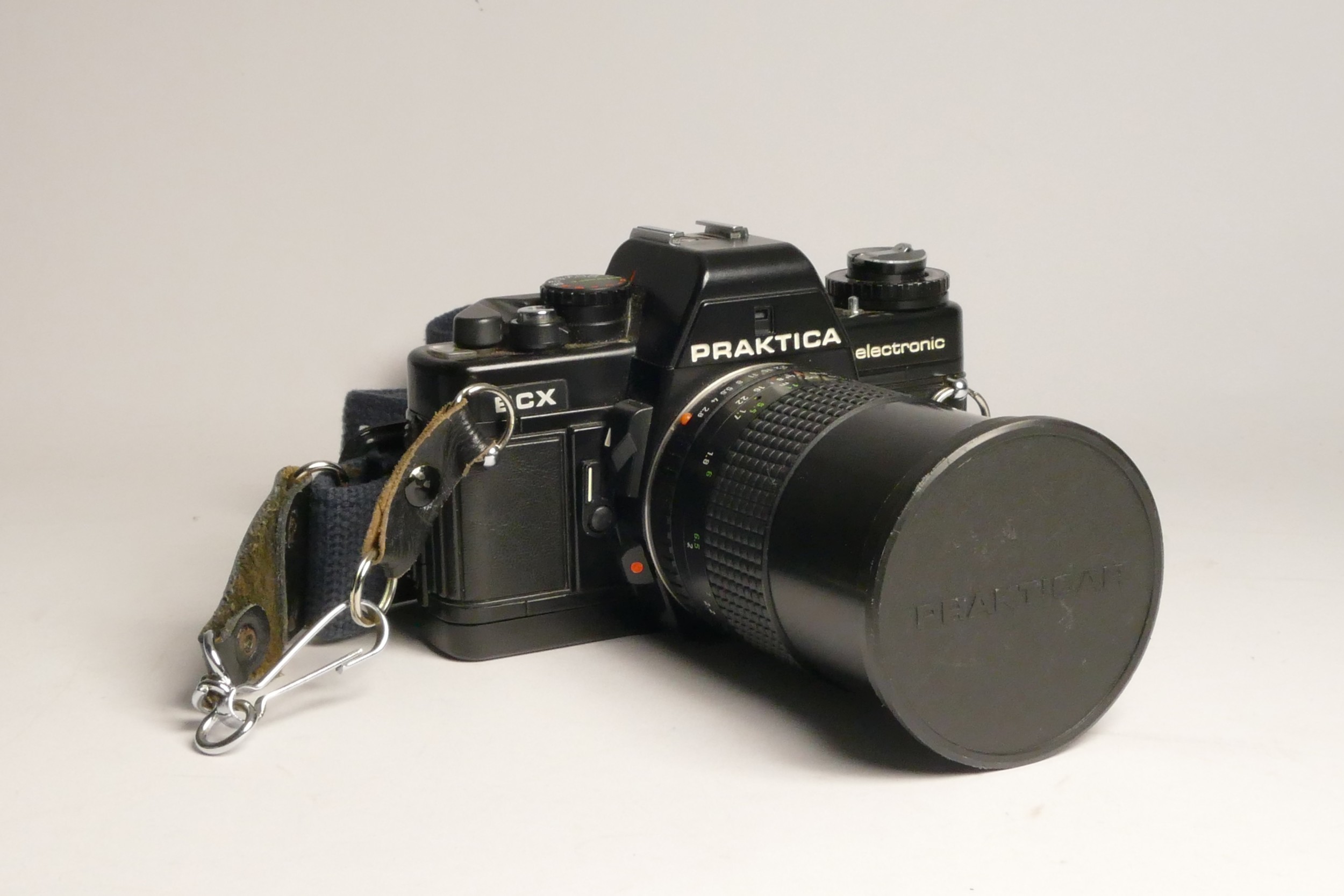 A Praktica BCX Electronic 35mm film camera, with a Prakticar 50mm f1.8 lens, a Prakticar 135mm f2.