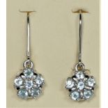 A pair of 9ct white gold and blue topaz cluster earrings, 2.5gm