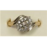 A 9ct gold and brilliant cut diamond set three row ring, O, 2.1gm