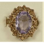 A 9ct gold and amethyst dress ring with abstract mount, stone 14 x 10mm, M, 3.6gm