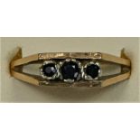 A 9ct gold three stone sapphire ring, Q, 3.6gm