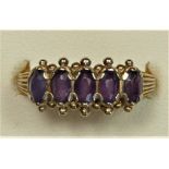 A 9ct gold Victorian style five stone amethyst ring, P, 2.4gm