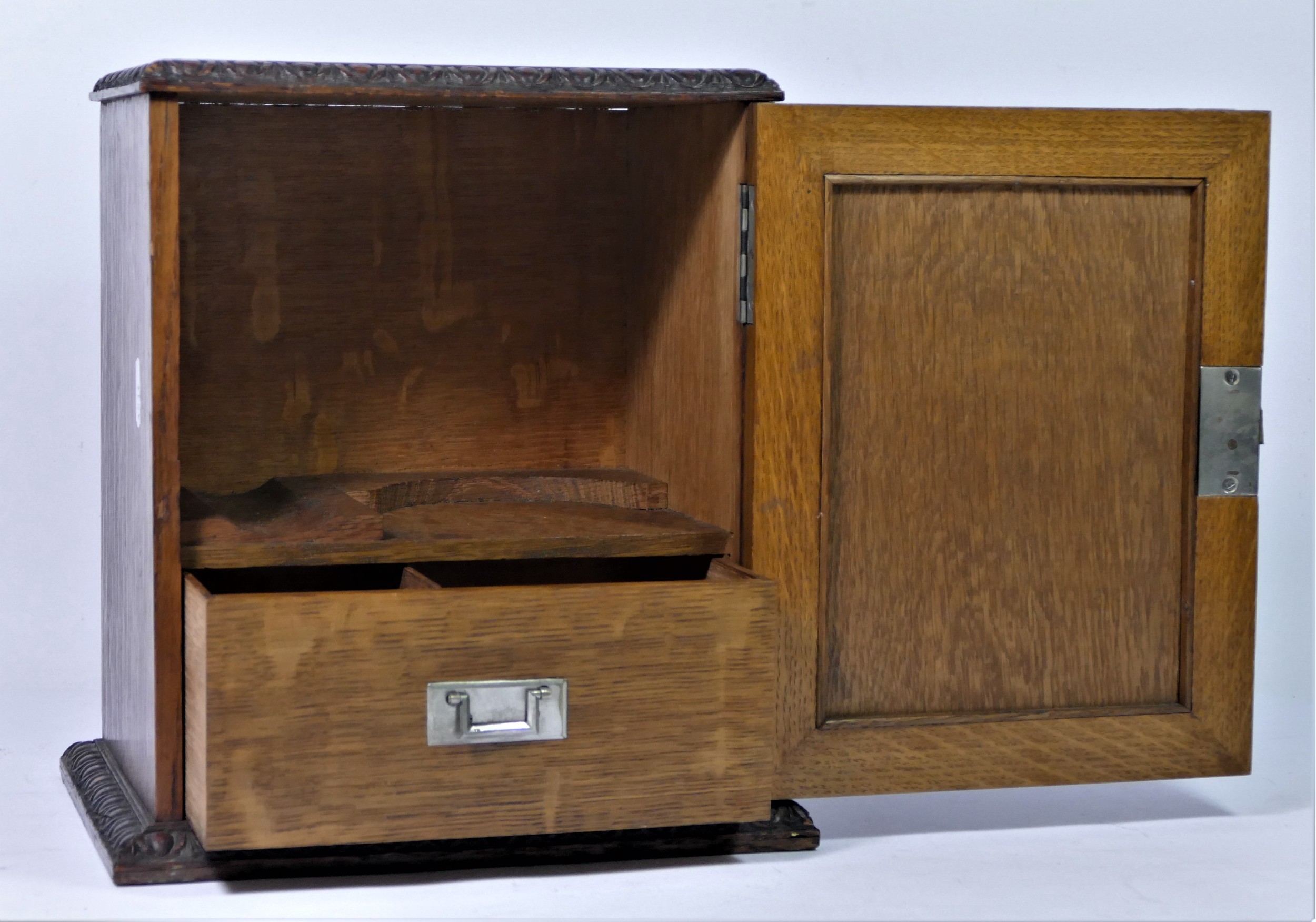 A late Victorian smokers cabinet, having carved panel door enclosing a fitted interior, - Bild 2 aus 3