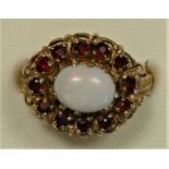 A 9ct gold opal and garnet cluster ring, ornate mount, N 1/2, 4.7gm