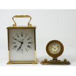 A 1980's Swiss Quartz carriage clock brass cased with silvered dial and Roman Numerals, retailed