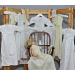 White cotton embroidered christening gowns and cream embroidered layettes. Average 64cm length (9)