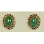 A 9ct gold pair of oval cabochon jade ear studs, 7 x 5mm, 1.6gm