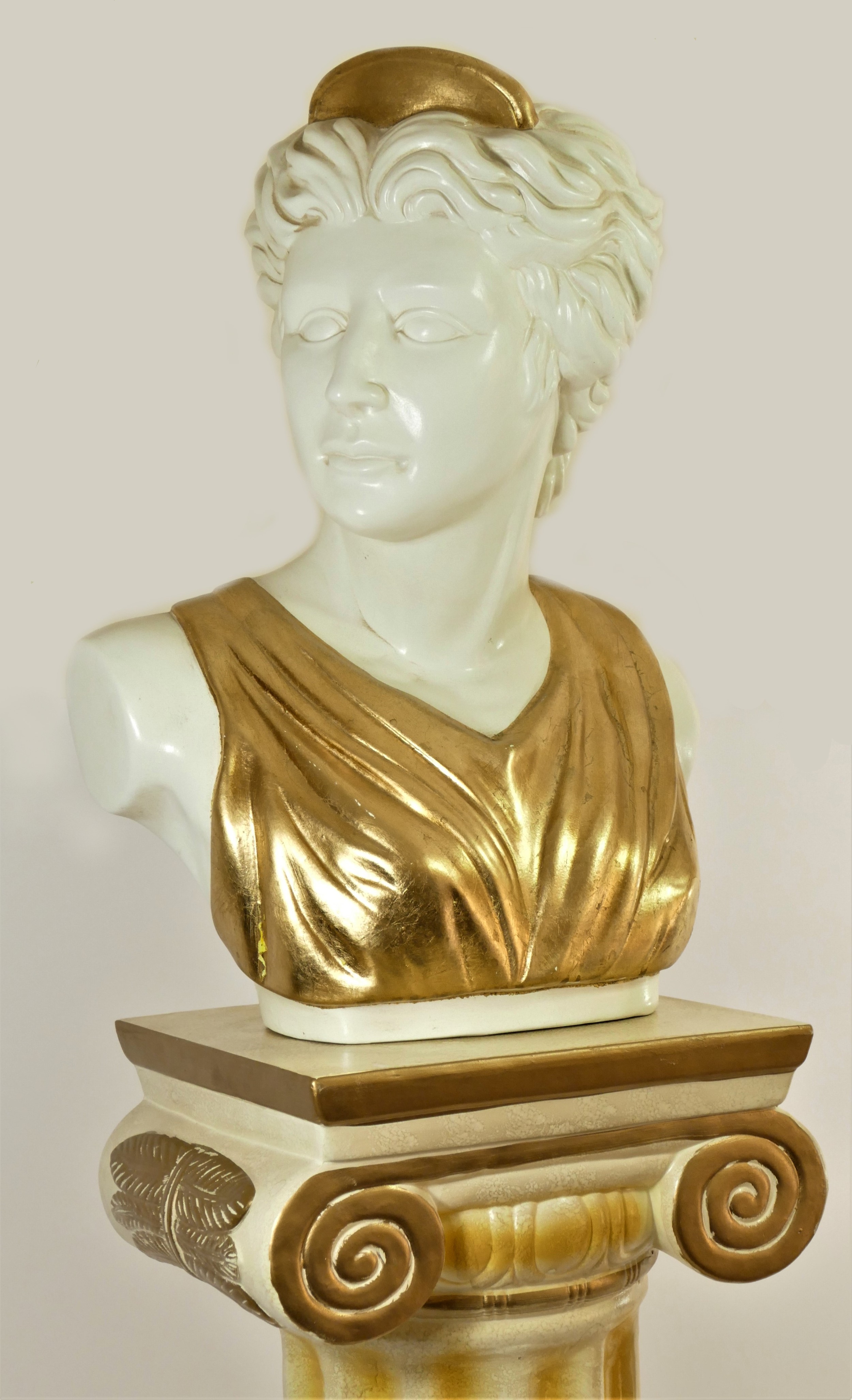 A ceramic bust of a Grecian / Roman female, with gilt head piece and dress, 34cm x 48cm x 26cm, on a - Image 2 of 2