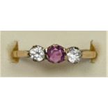 A 9ct gold ruby and CZ three stone ring, P, 1.5gm