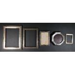 A silver photograph frame, London 1993, with reeded border, 21.5 x 6.5cm, no easel, another Dublin