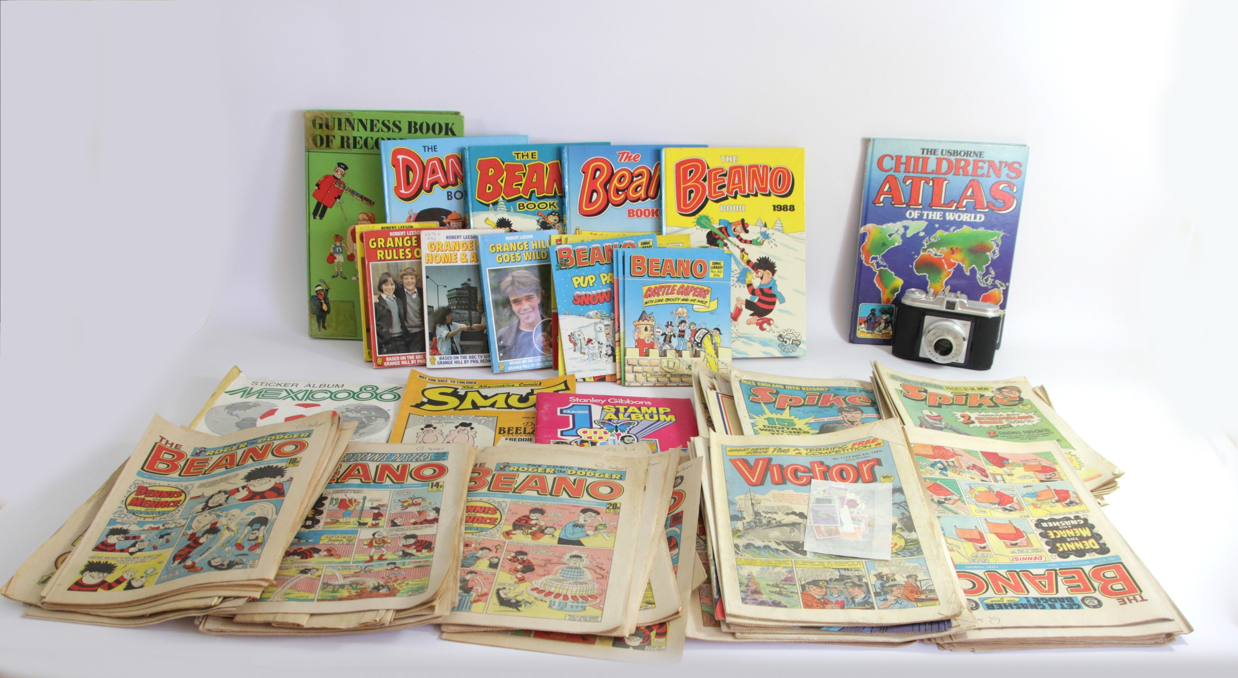 A collection of children's comics and books, to include the Beano, Viz, Smut, Spike and others, also