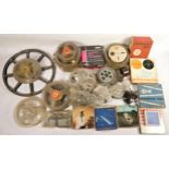 A collection of 16mm and 8mm reels, an Enmig mark 501 projector, a Dixons Toei Talkie 8mm