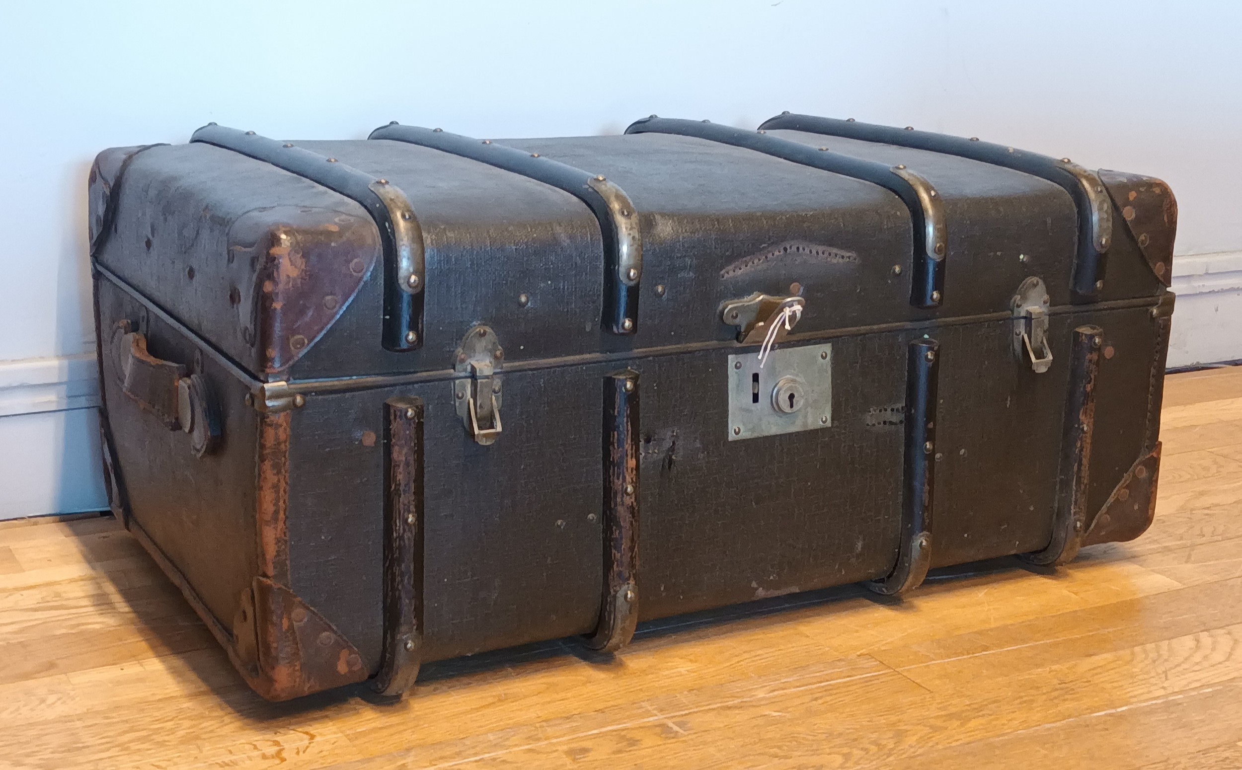 An early 20th Century beech bound & leather traveling trunk, with lined interior and fitted divider.