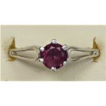 A 9ct white gold garnet single stone ring, N 1/2, 2.2gm