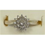 A 9ct white gold diamond cluster ring, stated weight 0.10cts, I, 1.5gm