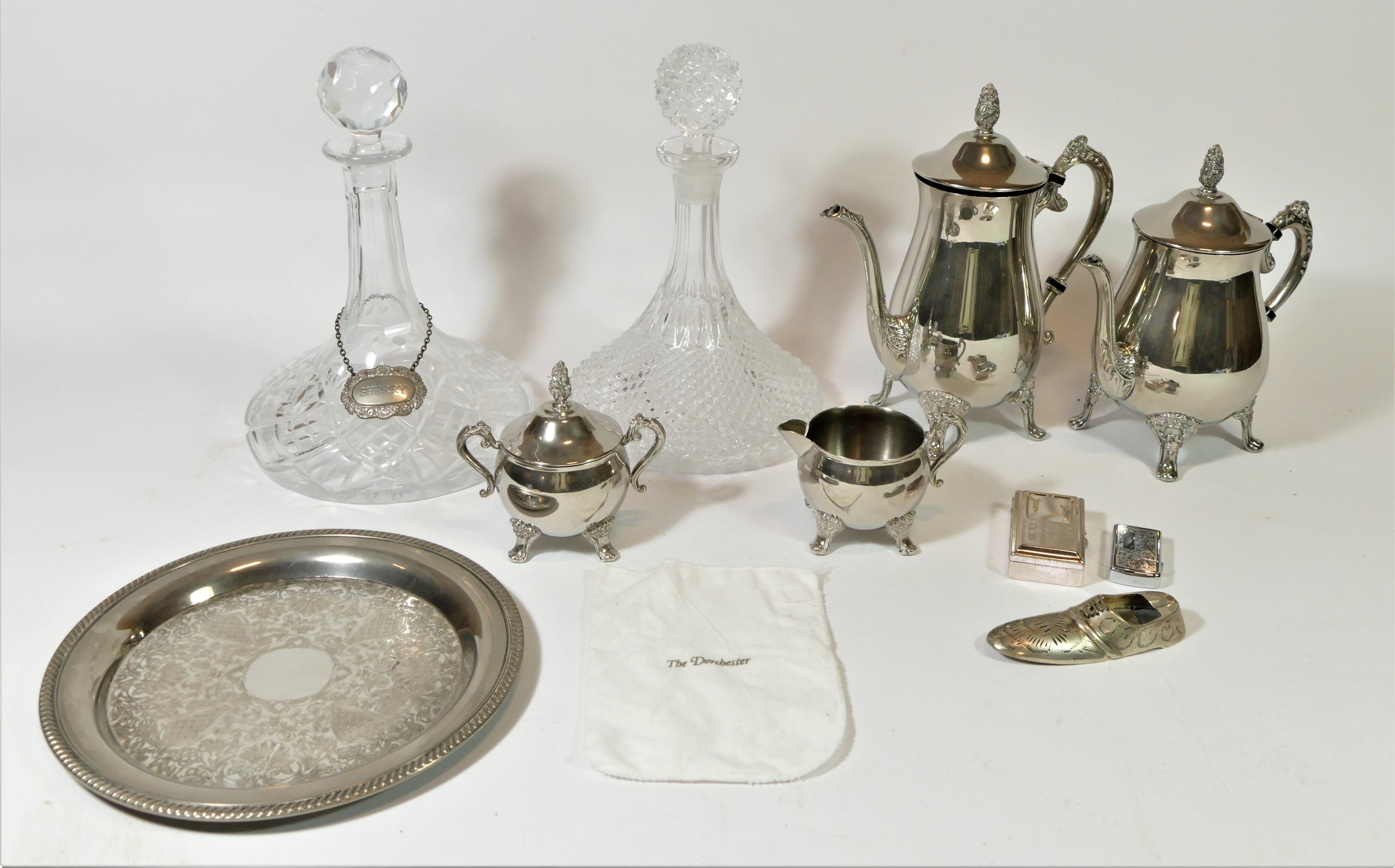 A silver plated four piece coffee/tea service, together with a pair of cut glass ships decanters,