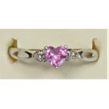 A 9ct white gold heart shape pink sapphire and diamond three stone ring, P, 1.3gm