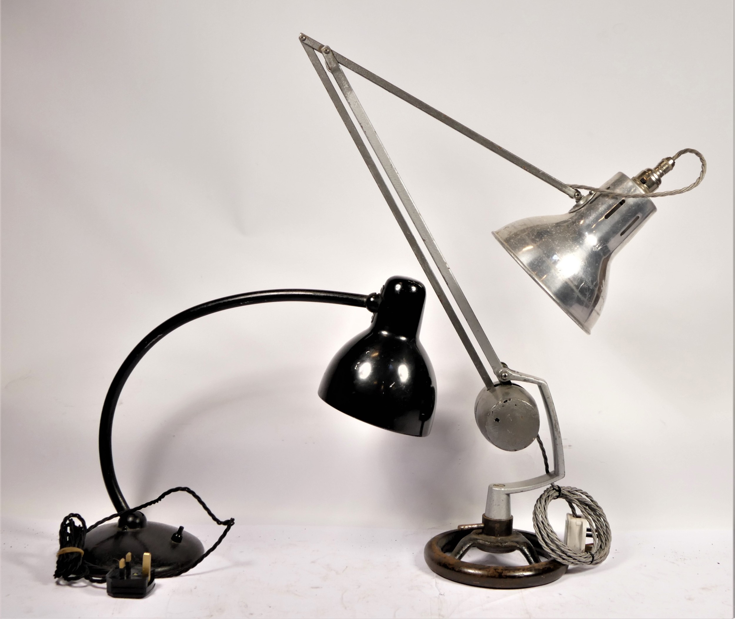 An early 20th Century anglepoise lamp, on cast iron wheel base, together with a painted cast metal