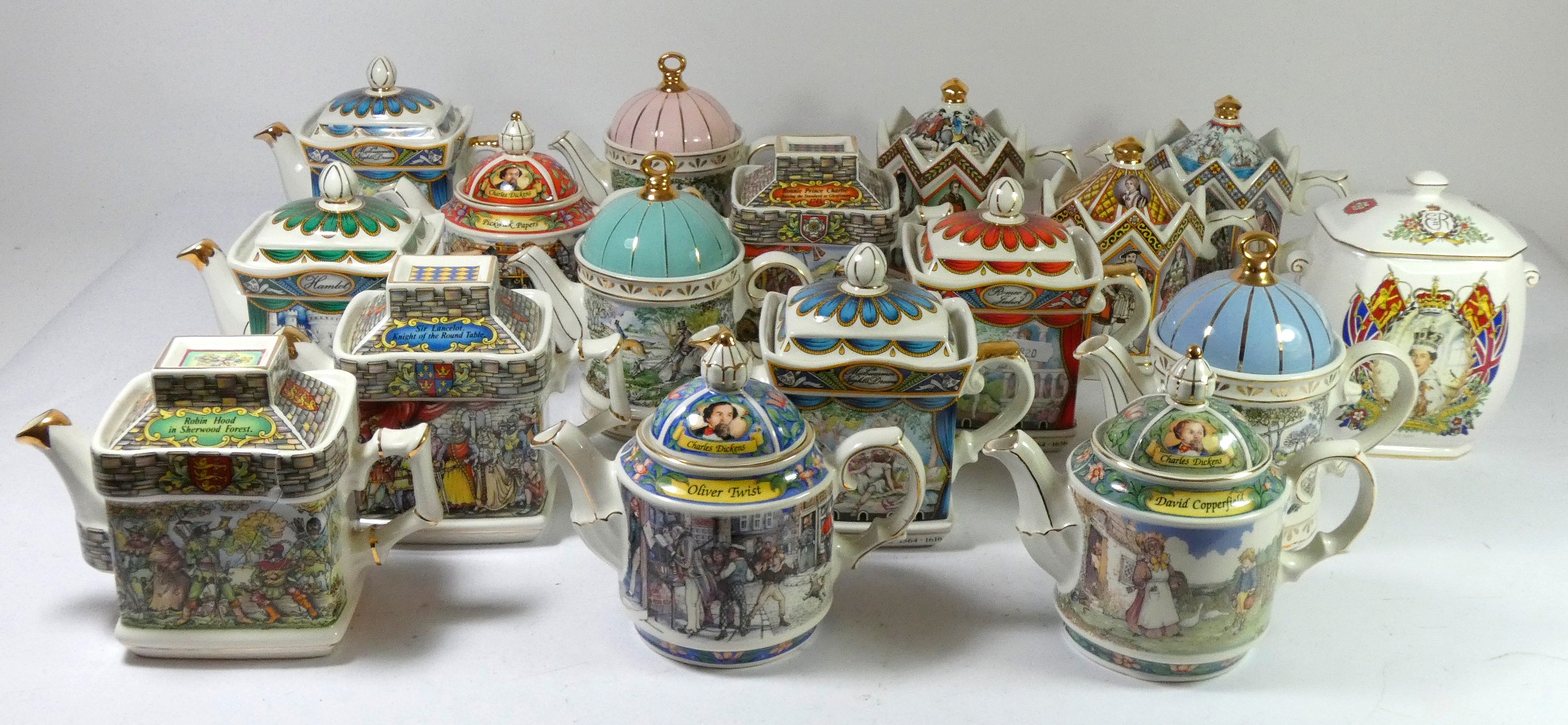 A collection of sixteen Staffordshire commemorative teapots by Sadler, to include Historical Series,