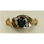 A 9ct gold sapphire and diamond three stone ring, R, 2.4gm