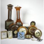 A collection of wall clocks, 8 day mantel clocks and barometers. (2)