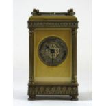A late 19th Century French lacquered brass mantel clock, 8 day movement stamped "R & Co". The case
