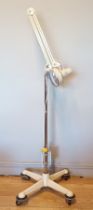 A mid 20th Century floor standing anglepoise surgical lamp, made by Thousand And One Lamps Ltd, of