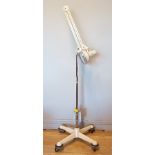 A mid 20th Century floor standing anglepoise surgical lamp, made by Thousand And One Lamps Ltd, of