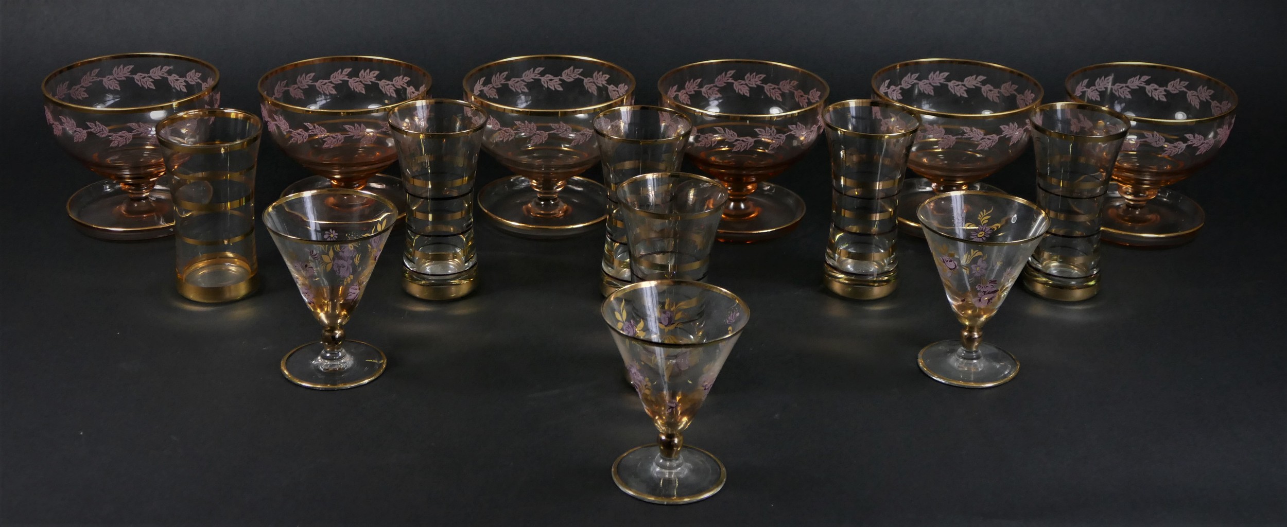 A collection of mid 20th Century glassware, gold banded with hand painted floral decoration, to