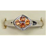 A 9ct white gold yellow topaz four stone ring, N, 1.9gm