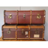 Two beech bound traveling trunks, early 20th Century, having leather carrying straps, brass