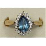 A 9ct gold pear shape blue topaz and brilliant cut diamond cluster ring, Q, 3.4gm