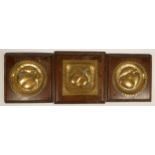 Three Arts and Craft brass panels, each hammered with apples and a pear, mahogany framed, 21cm and