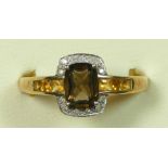 A 9ct gold, yellow gemstone and diamond cluster ring, V, 2.9gm