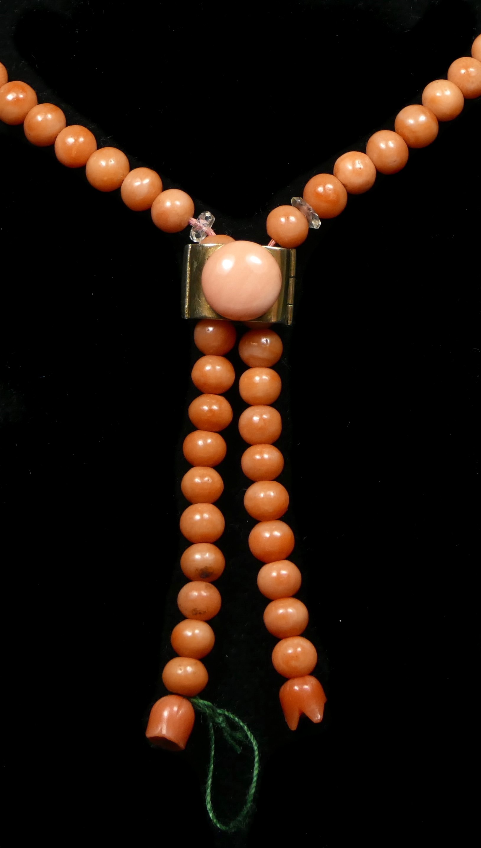 An Art Deco coral bead and facetted rock crystal sautoir necklace, with silver gilt slide, beads