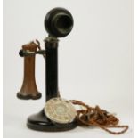 A GEC style black painted candlestick telephone with adjustable speaker, height 30cm.