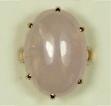 A 9ct rose gold vintage rose quartz dress ring, Birmingham 1975, claw set with a cabochon stone,