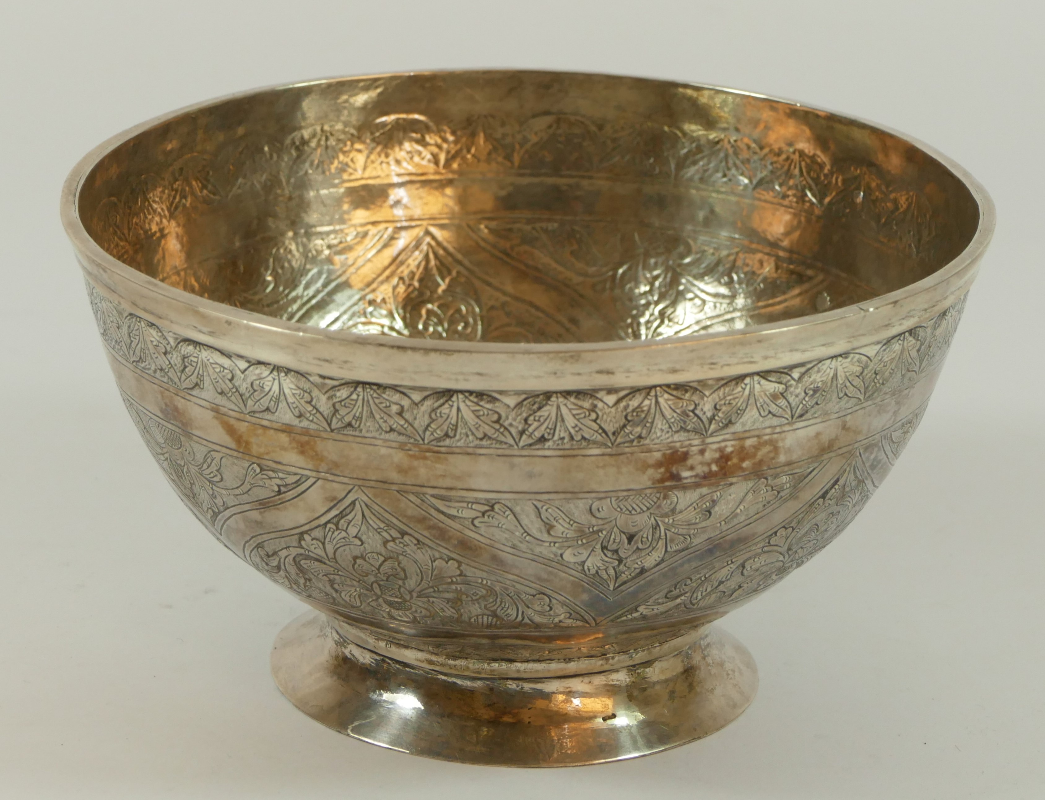 A 19th century Persian silver bowl, with floral chased decoration, 15cm, 260gm