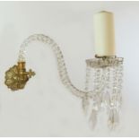 A pair of glass wall lights, converted from gas to support candles, the clear twist stem with