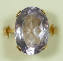 A 9ct gold amethyst dress ring, claw set with an oval mixed cut stone, 18 x 13mm, N, 4.8gm