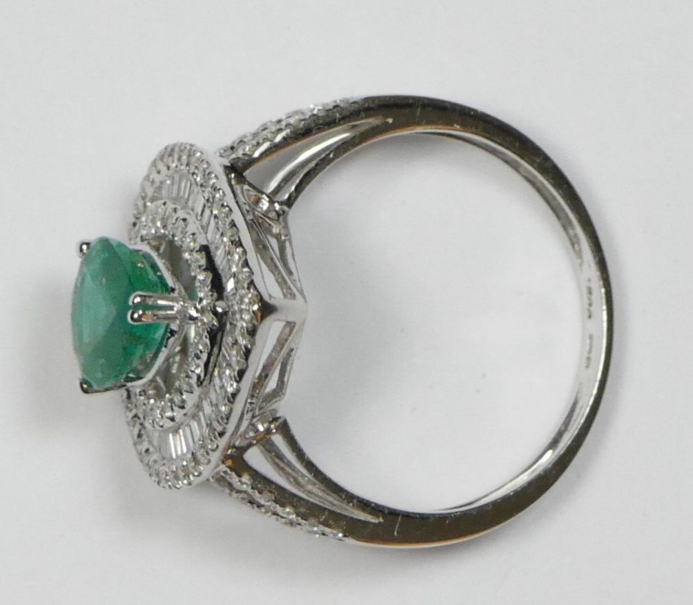 An 18ct white gold emerald and diamond cluster ring, claw set with a pear cut stone, approximately - Image 2 of 2