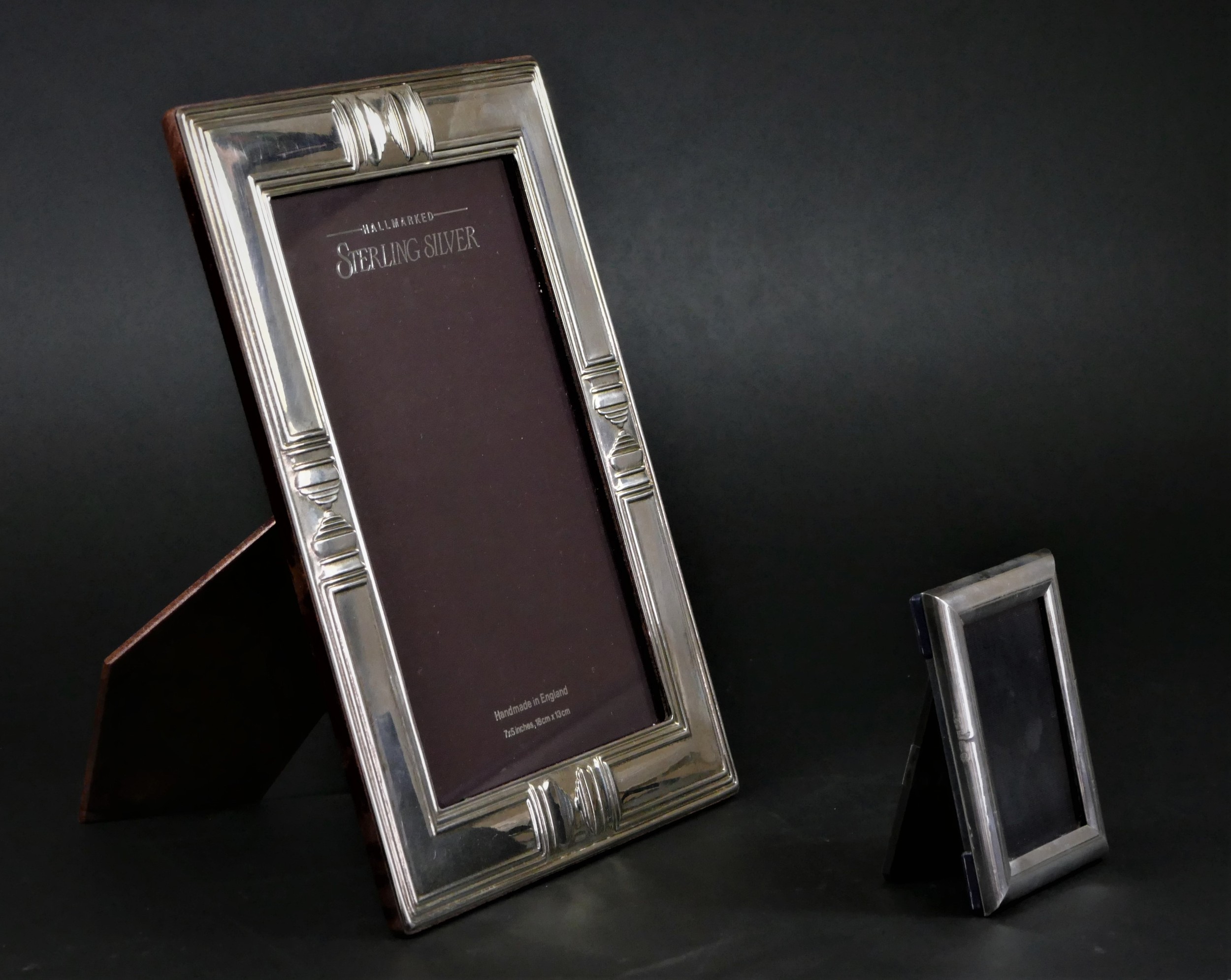 A silver photograph frame, Sheffield 1991, with embossed decoration, 22 x 17cm, together with a - Image 2 of 4
