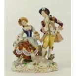 Sitzendorf, a seated man and woman hard paste porcelain figure group, with a dog and a sheep.