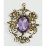 A late Victorian 9ct gold, amethyst and half pearl pendant, 9ct tab, the central mixed cut stone